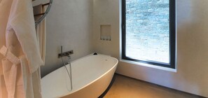 Bathtub, hair dryer, towels
