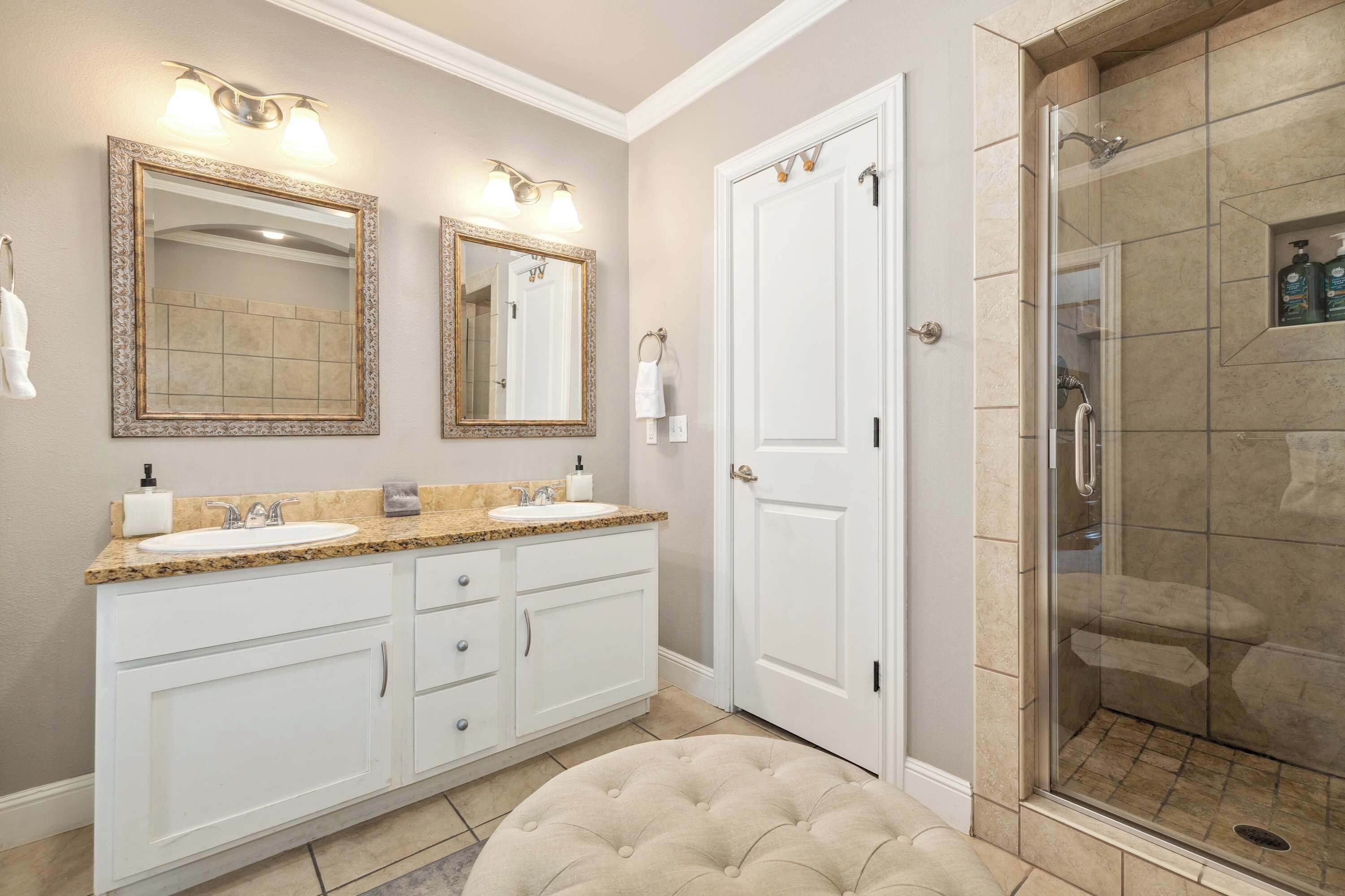 Bathtub, hair dryer, towels, shampoo