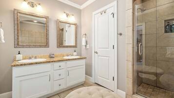Bathtub, hair dryer, towels, shampoo