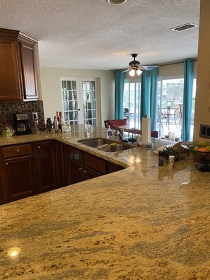 Fridge, microwave, oven, stovetop - Bikini Bottom is a Beautiful South East Cape Coral canal front home. (Cape Coral)