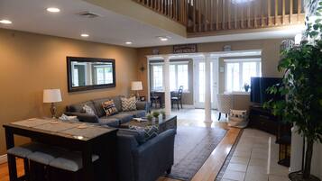 Smart TV, fireplace, foosball, books