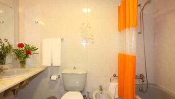Combined shower/tub, hair dryer, bidet, towels