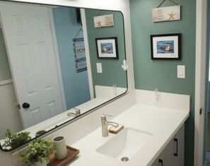 Shower, hair dryer, towels, shampoo