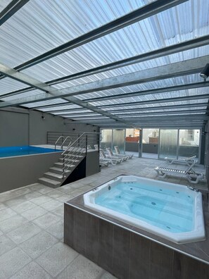 Indoor pool, open 11:00 AM to 8:00 PM, pool loungers
