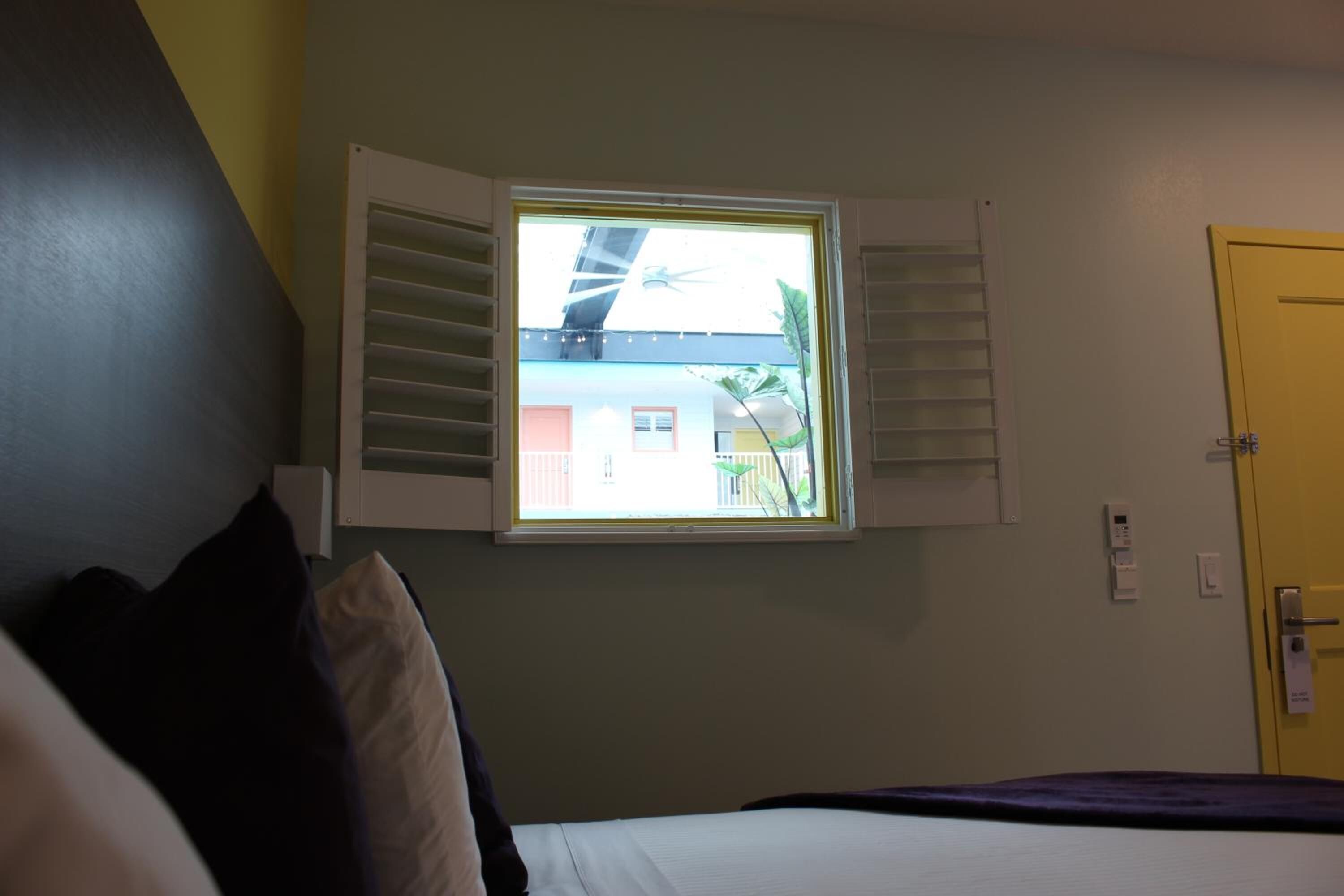 premium bedding, pillow-top beds, desk, laptop workspace