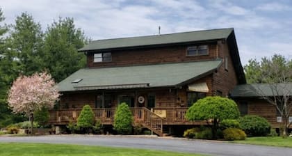 Lower level unit in Spectacular Log Home Estate