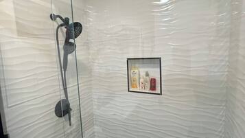 Shower, towels, soap, toilet paper