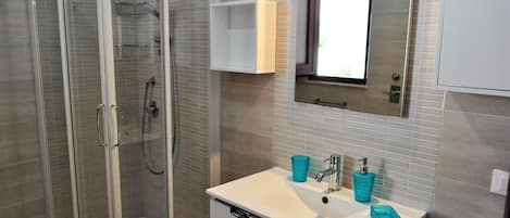 Shower, hair dryer, bidet, toilet paper