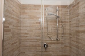 Shower, hair dryer, bidet, toilet paper