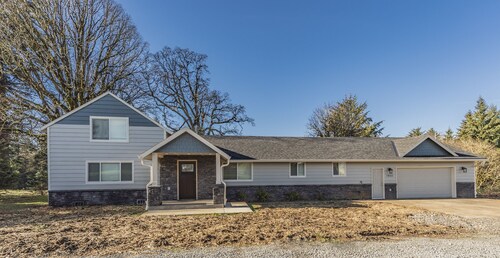 Beautiful like new home with a large hot tub in a quiet neighborhood on Acreage.