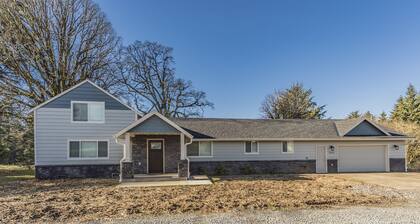 Beautiful like new home with a large hot tub in a quiet neighborhood on Acreage.