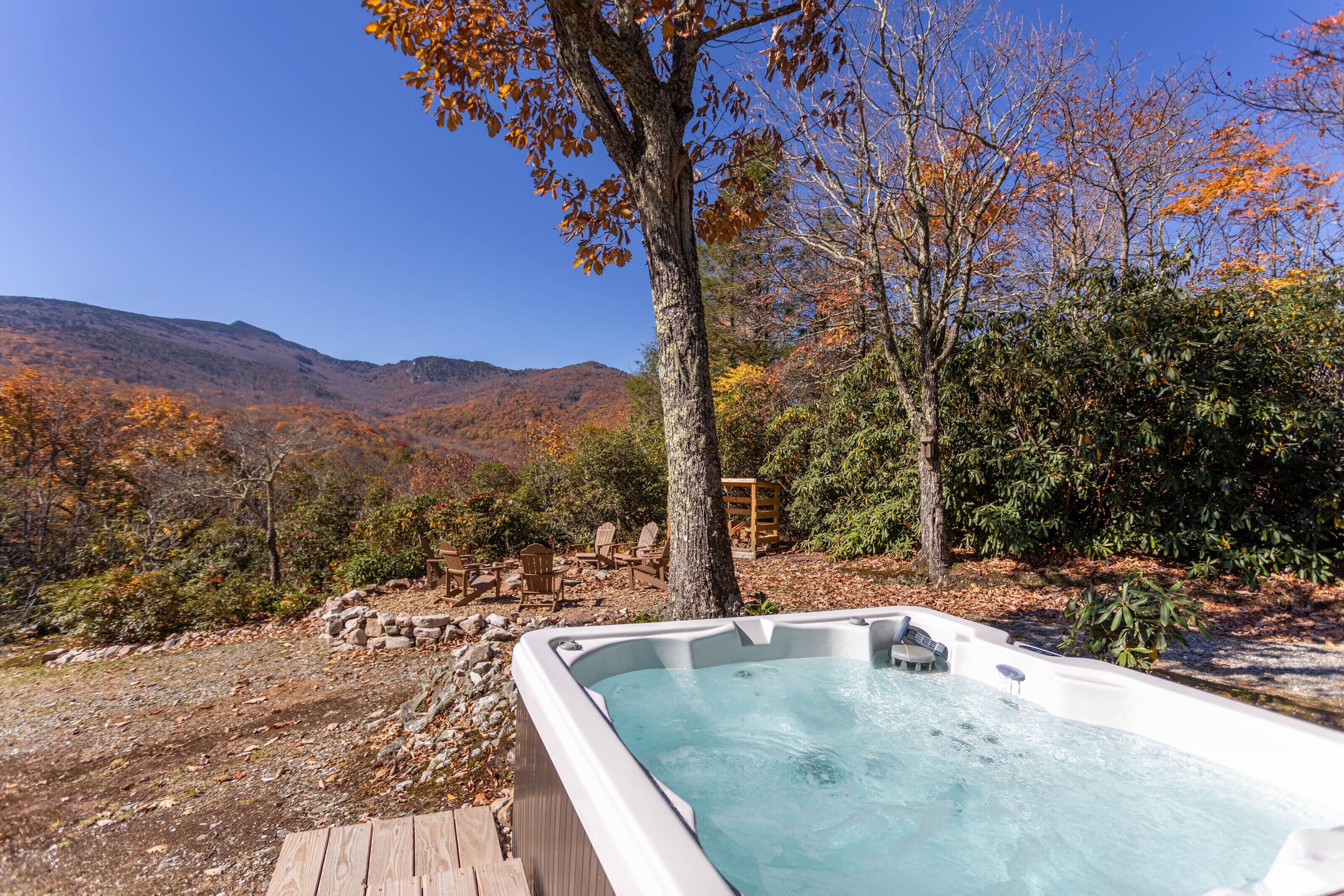 Soak in the hot tub while fall color sweeps across the Blue Ridge peaks. Pure mountain magic at Heaven'S View.