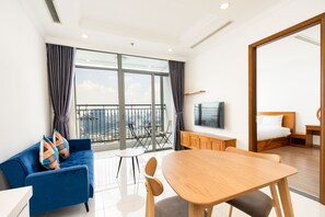 Economy Apartment, 2 Bedrooms | Living area | 49-inch Smart TV with digital channels, TV - Sens House Saigon – Serviced Apartments in Vinhomes Central Park (Ho Chi Minh City)