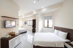 Family Room, Balcony | Minibar, desk, free WiFi, bed sheets