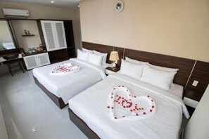 Deluxe Quadruple Room, Balcony | Minibar, desk, free WiFi, bed sheets