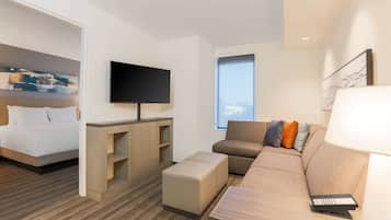 Hypo-allergenic bedding, desk, laptop workspace, blackout drapes