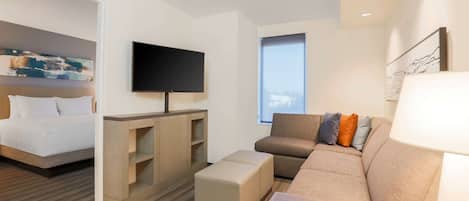 Hypo-allergenic bedding, desk, laptop workspace, blackout curtains