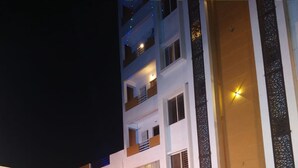 A multi-story hotel with a stage set up for an event.