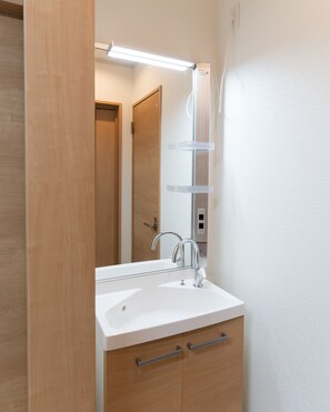 Shower, hair dryer, towels, toilet paper