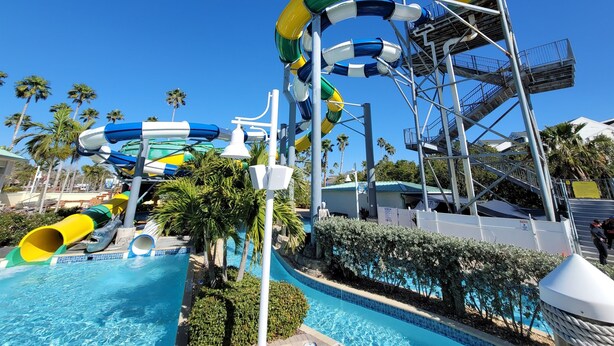 A water park with multiple slides and a pool area.