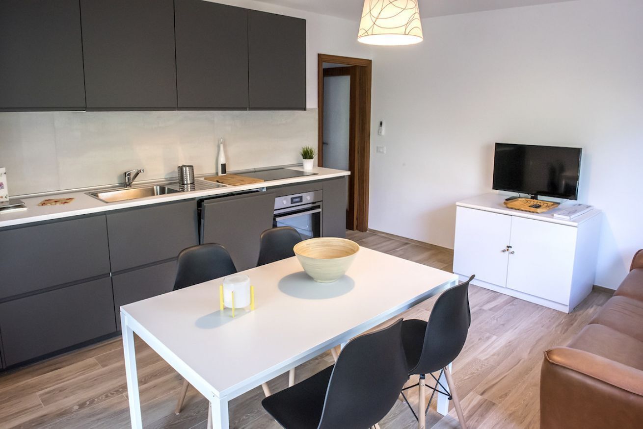 Fridge, oven, dishwasher, dining tables