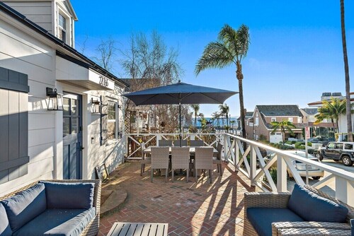 Nestled in the heart of Corona del Mar's coveted "Flower Streets," 216 Fernleaf Ave is the quintessential coastal cottage that captures the effortless charm and laid-back luxury of classic SoCal beach living.