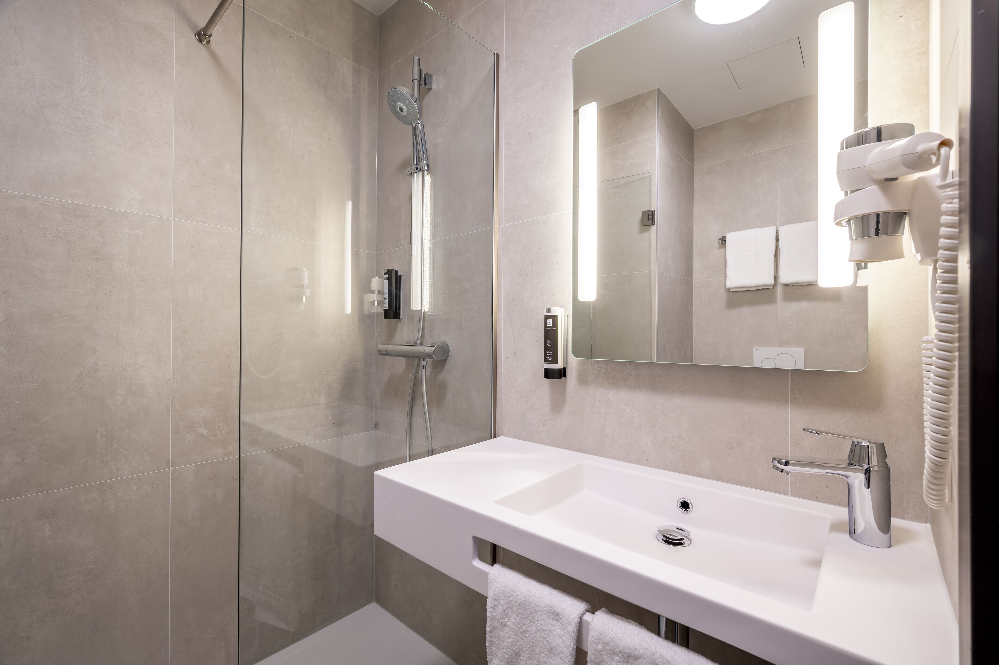 shower, rainfall showerhead, hair dryer, towels