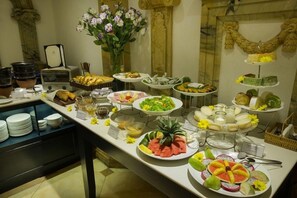 A buffet with various food items and a coffee station. - Hanoi Media Hotel And Spa (Hanoi)
