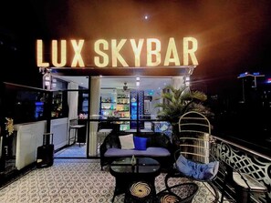 A rooftop bar named 'LUX SKYBAR' with a bar area, seating, and a view of the cityscape. - Hanoi Media Hotel And Spa (Hanoi)