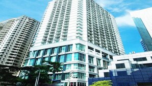 A high-rise building with a modern design, featuring multiple floors and large windows. - A Best Seri Bukit Ceylon Serviced Residence (Kuala Lumpur)