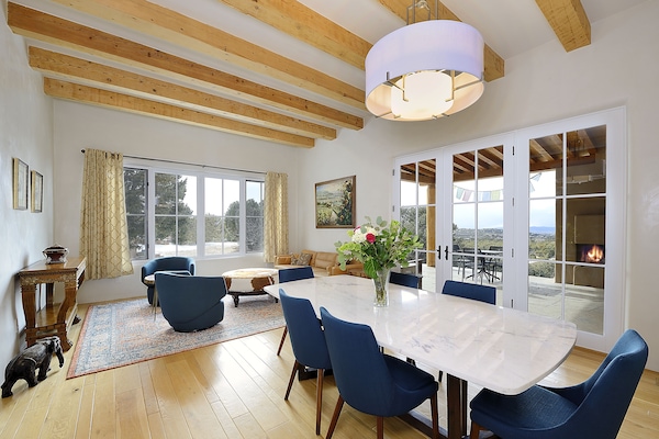Open space dining and living area - patio doors to portico with outside seating
