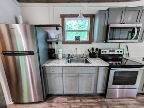 Fridge, microwave, oven, stovetop - Family Retreat Tiny House - 670+ acres private property on Lake Guntersville! (Guntersville)