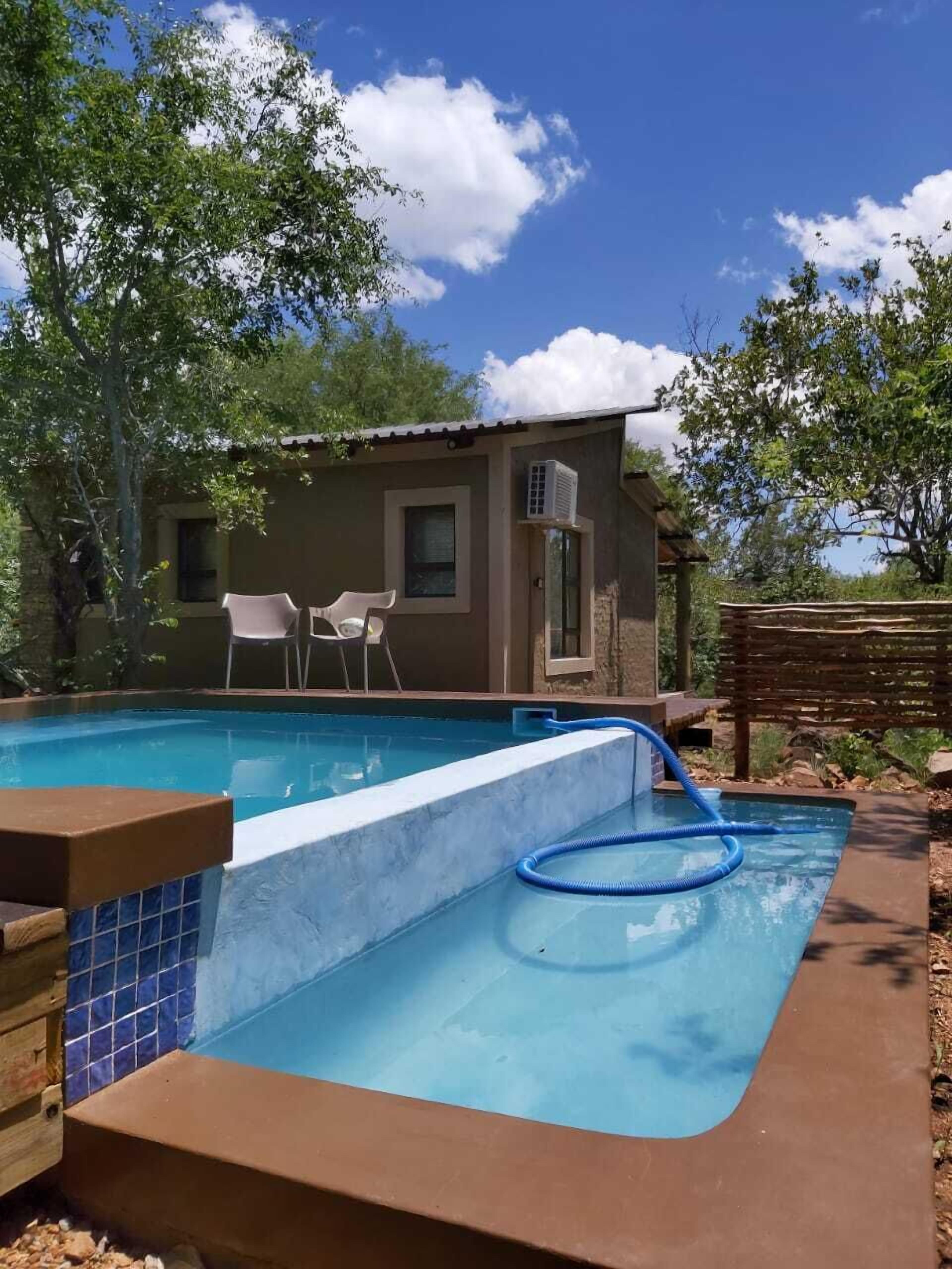 Three separate chalet with a swimming pool in-between 