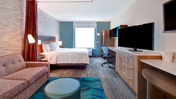 Suite estudio, 1 cama King size, para no fumadores | Área de sala de estar | Smart TV de 49 pulgadas con canales vía satélite, televisión y Netflix