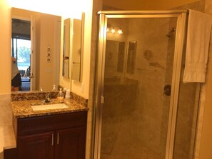 Combined shower/bathtub, hair dryer, towels, soap - Beautiful 3 bed 3 bath canal home with large lanai, heated pool and hot tub. (Cape Coral)