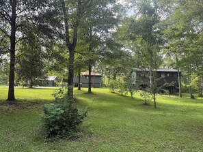 Property grounds - Cozy Camp w/ fire pit, grill and waterfront view of river. Pet Friendly! Wifi! (Robert)