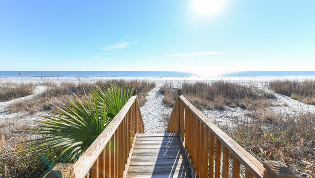 A wooden boardwalk leading to a beach with sand dunes and a clear blue sky. - Oceanfront 5 BR Beach House with a Private Pool! Tranquility (Surfside Beach)