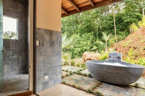 Bathtub, hair dryer, towels, soap