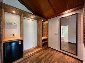 A room with a built-in heater, a mirror, and a wooden floor. - Airis Sanctuary Resort (Langkawi)