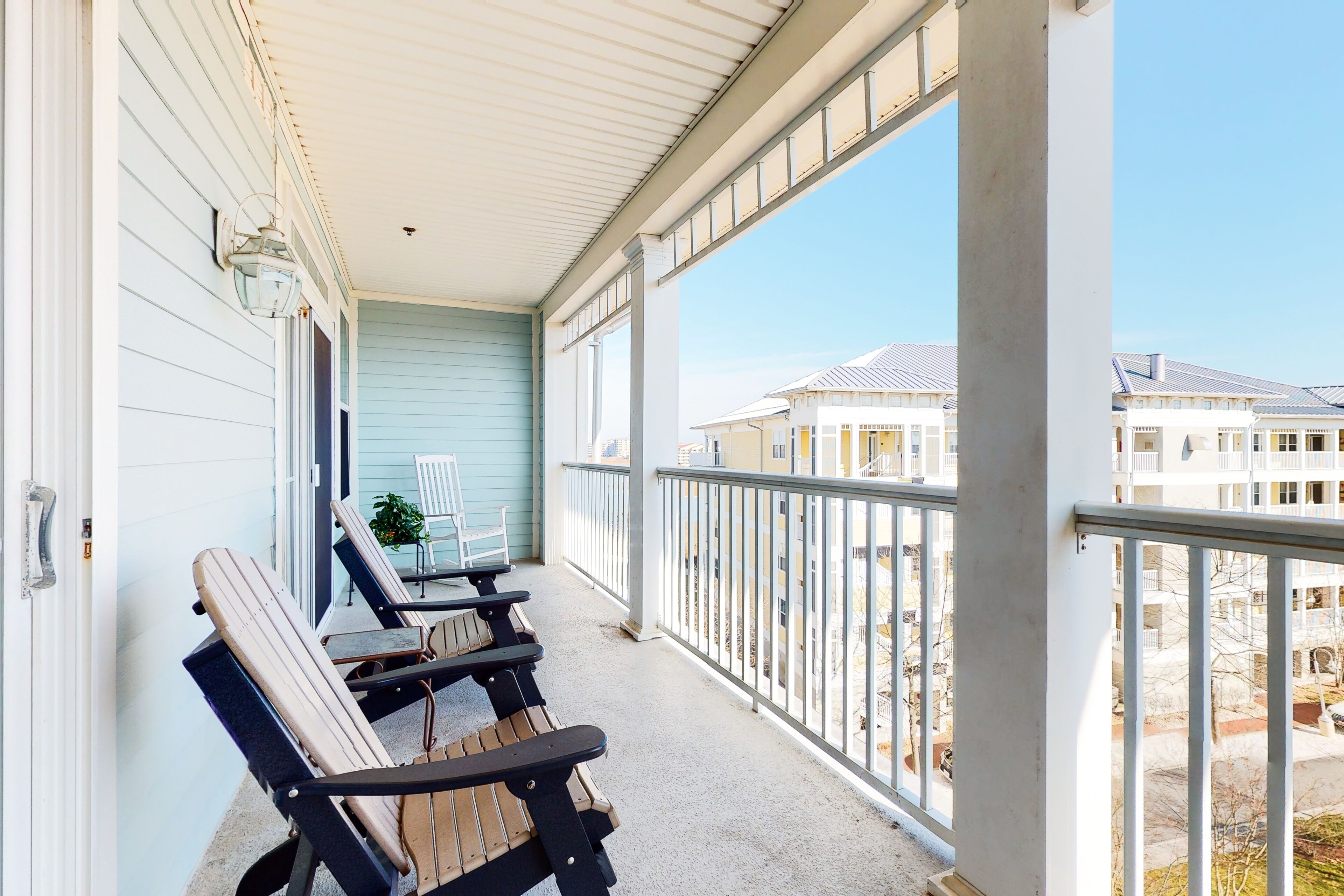 Top-floor beach condo w/ partial bay views, shared pools, & central AC
