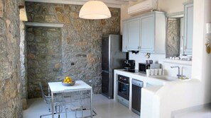 Enjoy casual dining or tea in this kitchen with a sink, oven, microwave, and dishwasher.