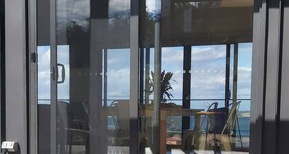 Stunning water views; relaxed coastal atmosphere; multiple entertaining areas