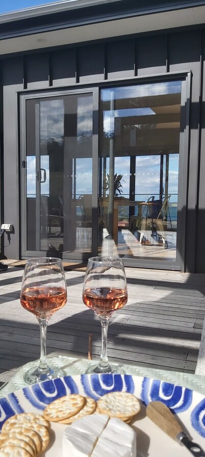 Stunning water views; relaxed coastal atmosphere; multiple entertaining areas 