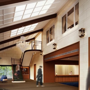 A spacious lobby with a grand chandelier, a staircase, and a reception desk. - Oarai Park Hotel (Oarai)