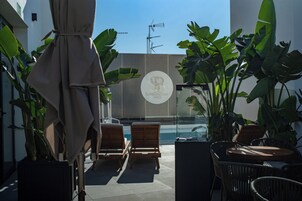 Seasonal outdoor pool, pool umbrellas, pool loungers