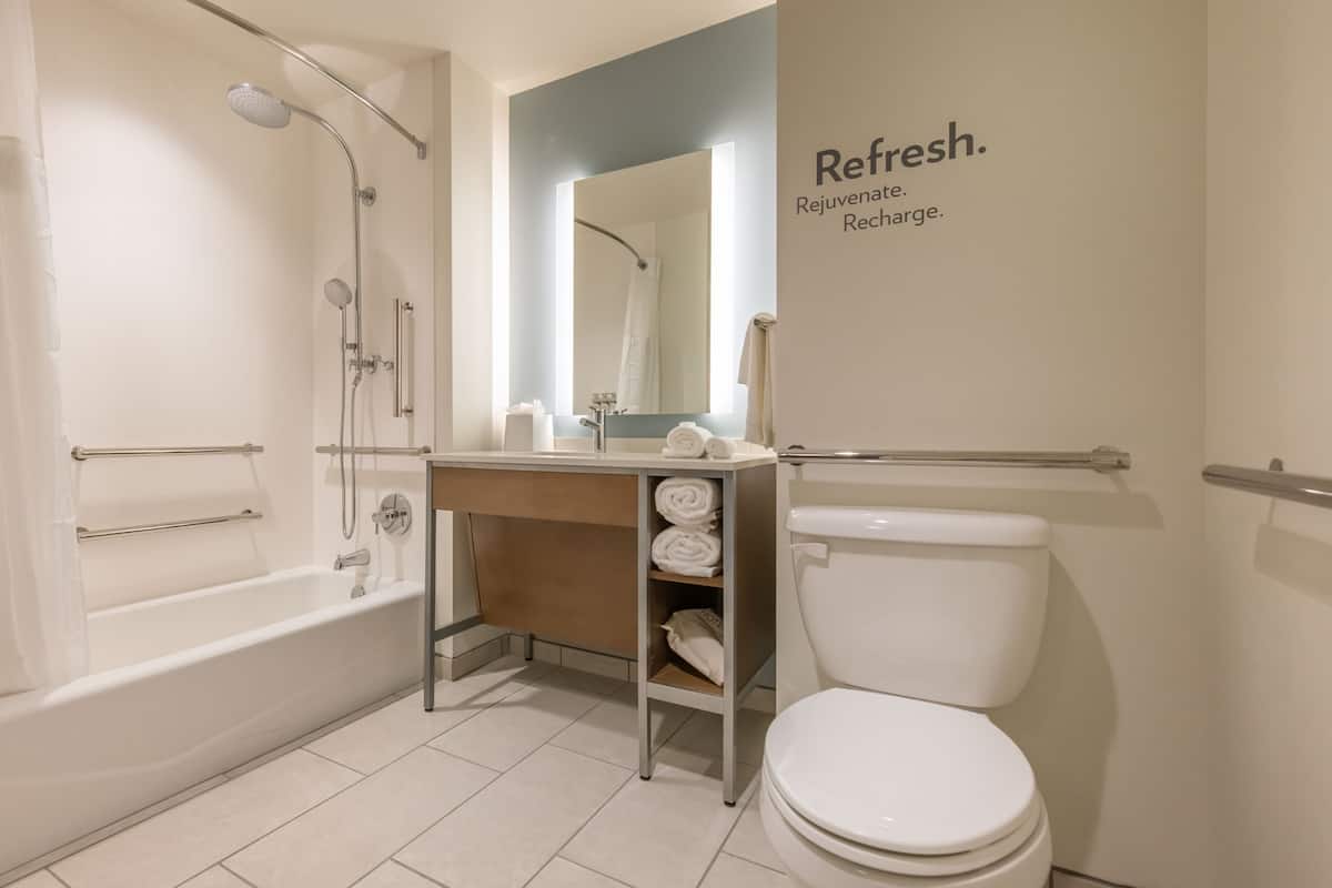 designer toiletries, hair dryer, towels, soap