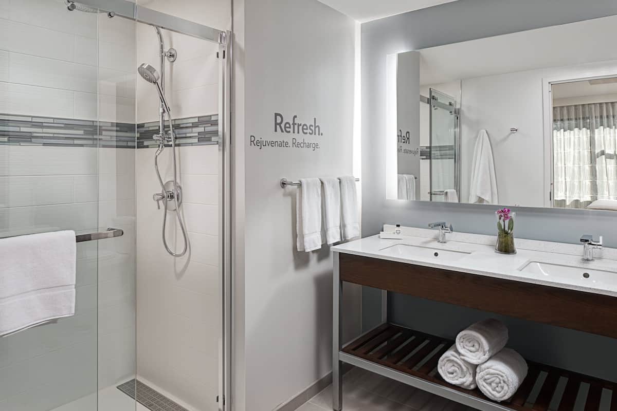 designer toiletries, hair dryer, towels, soap
