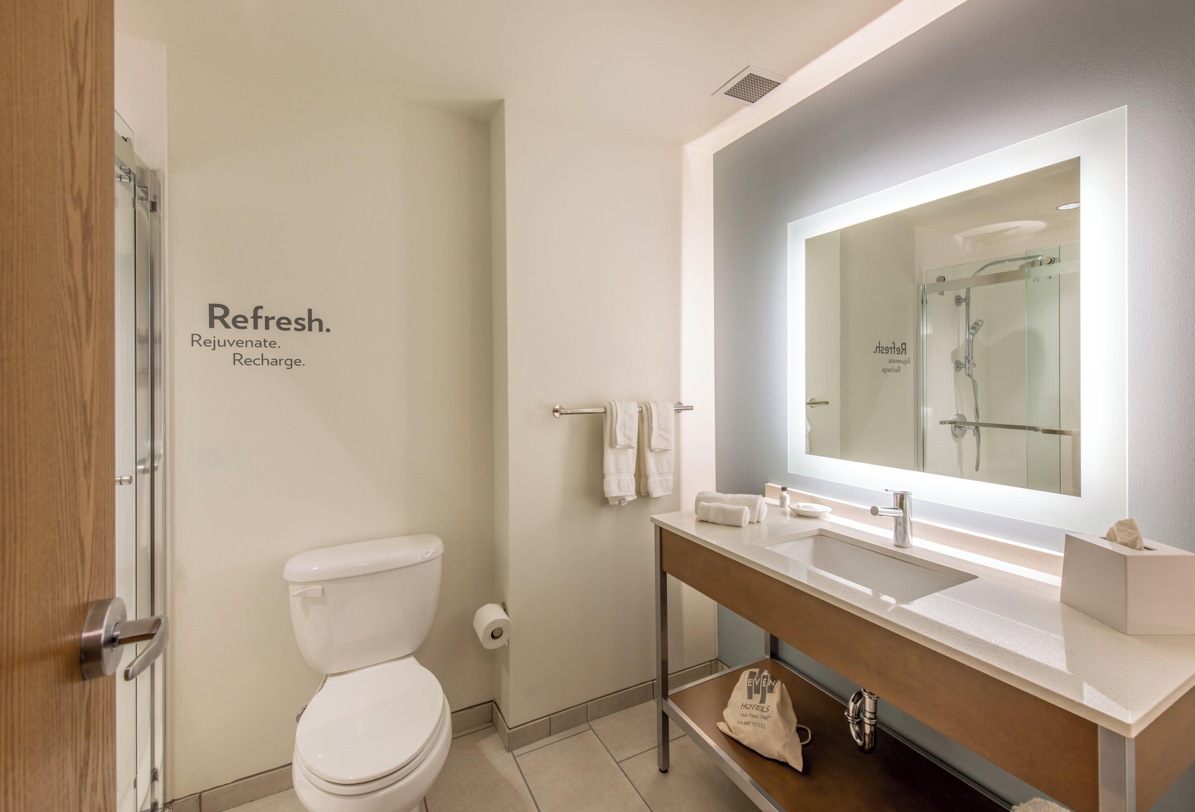 designer toiletries, hair dryer, towels, soap