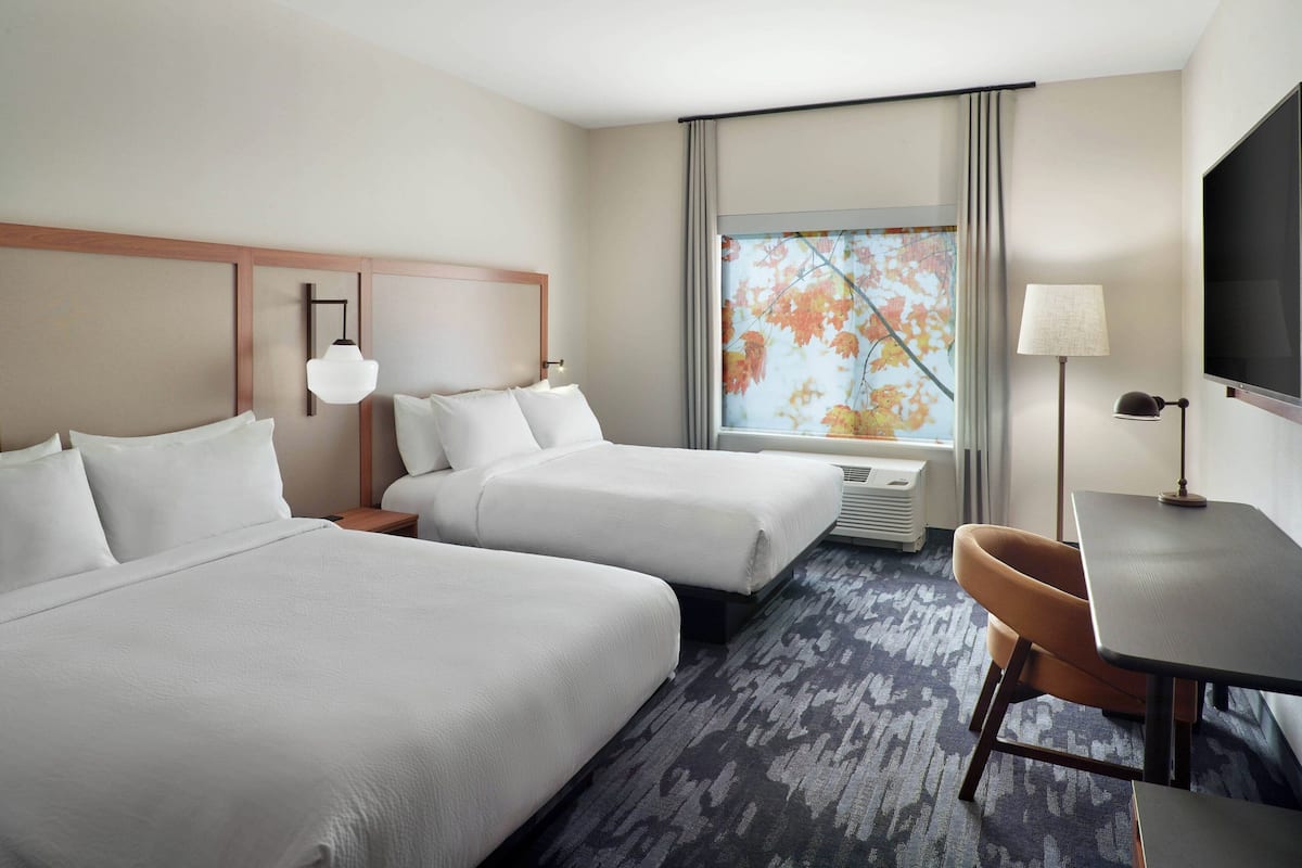 hypo-allergenic bedding, desk, laptop workspace, blackout curtains