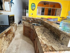 Fridge, microwave, stovetop, coffee/tea maker